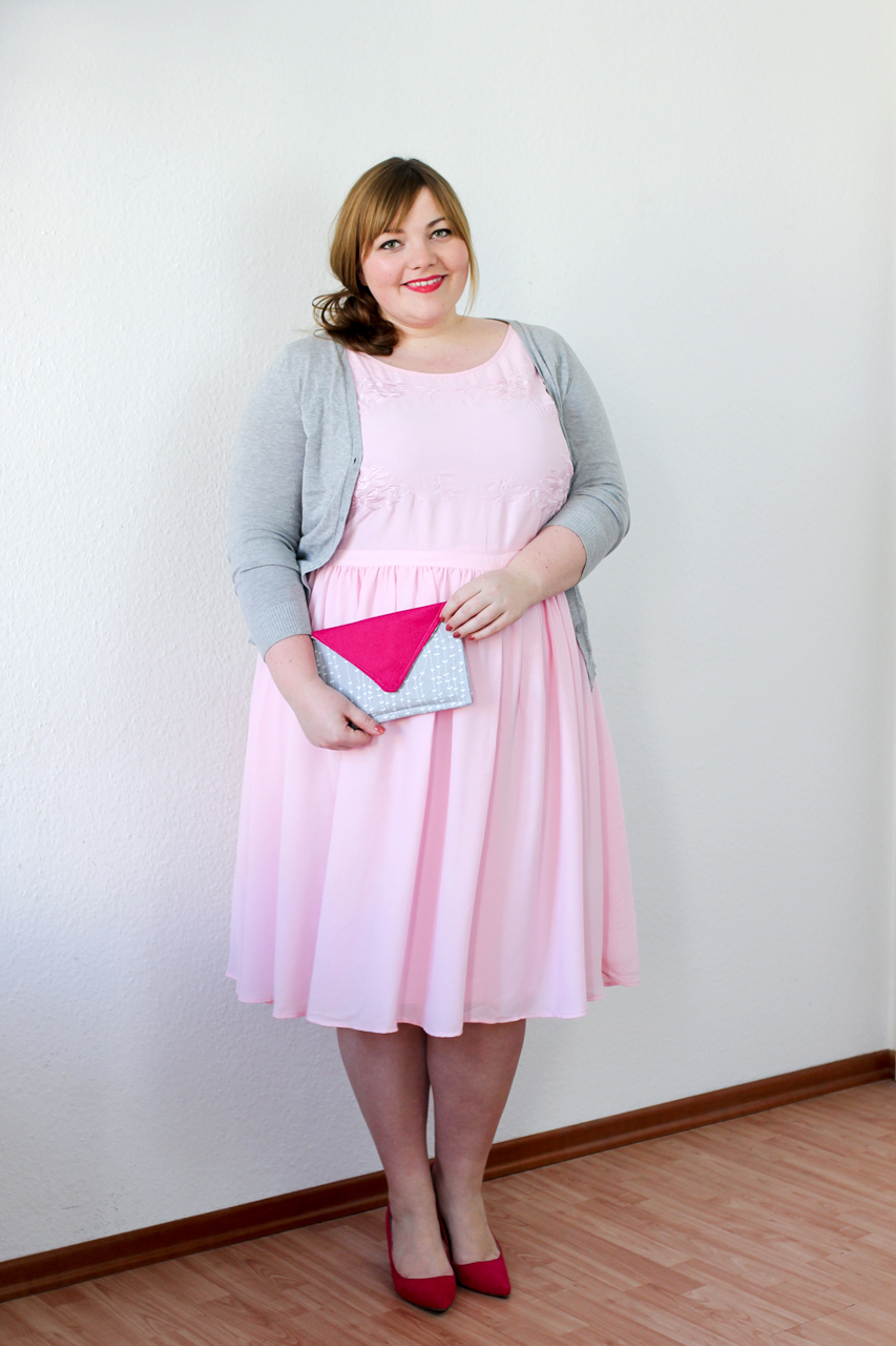 Plus Size Outfit for Valentine's Day, wearing a pink dress & handmade envelope clutch